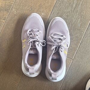 Under Armour Women’s Lilac sneakers  with Gold Accents. Size 9